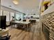 An open concept view of the living room with a modern fireplace and kitchen at 5422 Nestled Moon Ct, Las Vegas, NV 89131