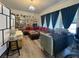 Bright living room with hardwood floors, plush seating, and elegant decor at 5422 Nestled Moon Ct, Las Vegas, NV 89131