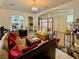 Spacious living room with plush seating, chandelier, and lots of natural light at 5422 Nestled Moon Ct, Las Vegas, NV 89131
