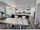 Spacious living room with an open floor plan, modern appliances, and lots of natural light at 5422 Nestled Moon Ct, Las Vegas, NV 89131