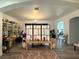 Open living room featuring neutral decor, wood floors, and ample lighting at 5422 Nestled Moon Ct, Las Vegas, NV 89131