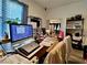 Functional home office setup with a large monitor and ample space for work or study at 5422 Nestled Moon Ct, Las Vegas, NV 89131