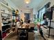 Organized home office space with shelves, monitors, and plants, perfect for productivity at 5422 Nestled Moon Ct, Las Vegas, NV 89131