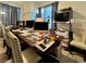Spacious office area with a large work table, comfortable seating, and plenty of light at 5422 Nestled Moon Ct, Las Vegas, NV 89131