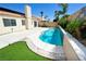 Serene backyard oasis features a swimming pool, landscaped areas, and ample patio space at 5521 Desert Valley Dr, Las Vegas, NV 89149