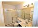 Bathroom with tub and shower combination, and modern fixtures providing comfort and style at 5521 Desert Valley Dr, Las Vegas, NV 89149