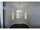 Charming dining area with elegant light fixture, hardwood floors and natural light at 5521 Desert Valley Dr, Las Vegas, NV 89149