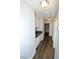 Hallway featuring neutral color palette, vaulted ceiling and counter space with cabinets at 5521 Desert Valley Dr, Las Vegas, NV 89149