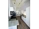 Bright kitchen features white cabinets, grey countertops and stainless steel appliances at 5521 Desert Valley Dr, Las Vegas, NV 89149