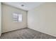 Bedroom features neutral walls, carpet floors, and a window providing natural light at 5915 Nuevo Leon St # 8, North Las Vegas, NV 89031