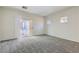 Bright bedroom with balcony access and large windows at 5915 Nuevo Leon St # 8, North Las Vegas, NV 89031