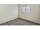Cozy bedroom boasts neutral walls, carpeted floors, and a bright, window at 5915 Nuevo Leon St # 8, North Las Vegas, NV 89031
