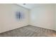 This bedroom has neutral walls, carpet flooring, and a window that fills the space with light at 5915 Nuevo Leon St # 8, North Las Vegas, NV 89031