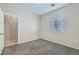 This bedroom has neutral walls, carpet flooring, and a window that fills the space with light at 5915 Nuevo Leon St # 8, North Las Vegas, NV 89031