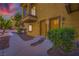 Inviting townhouse exterior with a cozy balcony, well-maintained landscape, and pathway leading to the entrance at 5915 Nuevo Leon St # 8, North Las Vegas, NV 89031