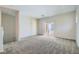 Spacious living room with neutral walls and sliding doors to balcony at 5915 Nuevo Leon St # 8, North Las Vegas, NV 89031