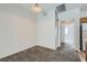 Inviting living room with neutral paint, carpet floors, and a connection to the kitchen at 5915 Nuevo Leon St # 8, North Las Vegas, NV 89031