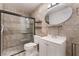 This bathroom has tile and a glass walk-in shower and modern vanity at 6711 W Charleston Blvd # 2, Las Vegas, NV 89146