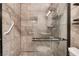 The bathroom offers a sleek glass shower with modern fixtures and a grab bar for safety at 6711 W Charleston Blvd # 2, Las Vegas, NV 89146