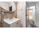 This bathroom has a unique vanity with tile, an oval mirror, and a partial view of the shower at 6711 W Charleston Blvd # 2, Las Vegas, NV 89146