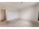 Neutral bedroom featuring carpet floors and walk-in closet with built-in shelves at 6711 W Charleston Blvd # 2, Las Vegas, NV 89146