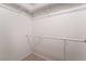 This white closet offers storage space with bars to hang clothes at 6711 W Charleston Blvd # 2, Las Vegas, NV 89146