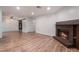 Spacious living room with a fireplace and wood-look flooring at 6711 W Charleston Blvd # 2, Las Vegas, NV 89146
