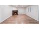 Cozy living room featuring wood flooring and a brick fireplace at 6711 W Charleston Blvd # 2, Las Vegas, NV 89146