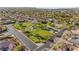 Aerial view of a neighborhood park surrounded by houses, offering green space and a community gathering spot at 6907 May Basket Ave, Las Vegas, NV 89131