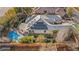 Aerial view of home with solar panels, backyard pool, patio cover, and beautiful landscaping at 6907 May Basket Ave, Las Vegas, NV 89131