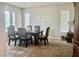 Traditional dining room with seating for six and natural light at 7020 Puetollano Dr, North Las Vegas, NV 89084