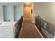 Upstairs hallway features neutral walls, carpet flooring, and stylish decorative shelving at 7020 Puetollano Dr, North Las Vegas, NV 89084