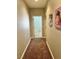 Hallway featuring neutral walls, carpet flooring, and artwork on the walls at 7020 Puetollano Dr, North Las Vegas, NV 89084