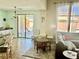 Connected living and dining area with natural light and patio access at 7020 Puetollano Dr, North Las Vegas, NV 89084