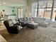 Spacious living area with sectional sofa and views of the patio at 7020 Puetollano Dr, North Las Vegas, NV 89084