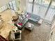 Spacious living room features a large sectional, floor-to-ceiling windows, and an adjacent dining area at 7020 Puetollano Dr, North Las Vegas, NV 89084