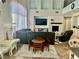 Open-concept living room with a large sectional sofa and fireplace at 7020 Puetollano Dr, North Las Vegas, NV 89084