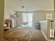 Large upstairs loft area featuring carpet flooring and plenty of room for entertaining at 7020 Puetollano Dr, North Las Vegas, NV 89084