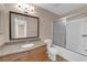 Bathroom with granite counters, a large mirror and a shower-tub combo at 7200 Pirates Cove Rd # 1011, Las Vegas, NV 89145