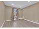 A cozy bedroom with wood-style flooring, neutral paint, and lots of natural light at 7200 Pirates Cove Rd # 1011, Las Vegas, NV 89145