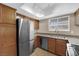 A kitchen with stainless steel appliances, modern countertops, and cabinetry at 7200 Pirates Cove Rd # 1011, Las Vegas, NV 89145