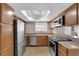 A modern kitchen with stainless steel appliances, granite countertops, and ample cabinet space at 7200 Pirates Cove Rd # 1011, Las Vegas, NV 89145
