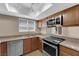 A well-lit kitchen featuring stainless steel appliances and modern countertops at 7200 Pirates Cove Rd # 1011, Las Vegas, NV 89145