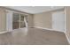 Open living space with wood-look flooring and access to outdoor balcony and front door at 7200 Pirates Cove Rd # 1011, Las Vegas, NV 89145