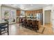 Modern kitchen with a central island, stainless steel appliances, and a door to the outside patio at 7417 Horizon Rock Ave, Las Vegas, NV 89179