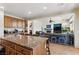 Open concept kitchen with a large island and views of the living room at 7417 Horizon Rock Ave, Las Vegas, NV 89179