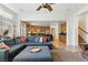 Spacious living room with tile flooring, stairs to the second floor and an open floor plan at 7417 Horizon Rock Ave, Las Vegas, NV 89179