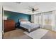 Spacious main bedroom offers plush carpeting, ceiling fan, and abundant natural light at 7417 Horizon Rock Ave, Las Vegas, NV 89179