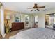 Spacious main bedroom with neutral paint, ceiling fan, plush carpet, and walk-in closet at 7417 Horizon Rock Ave, Las Vegas, NV 89179