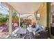 Inviting covered patio with comfortable seating and a view of the landscaped backyard at 7417 Horizon Rock Ave, Las Vegas, NV 89179